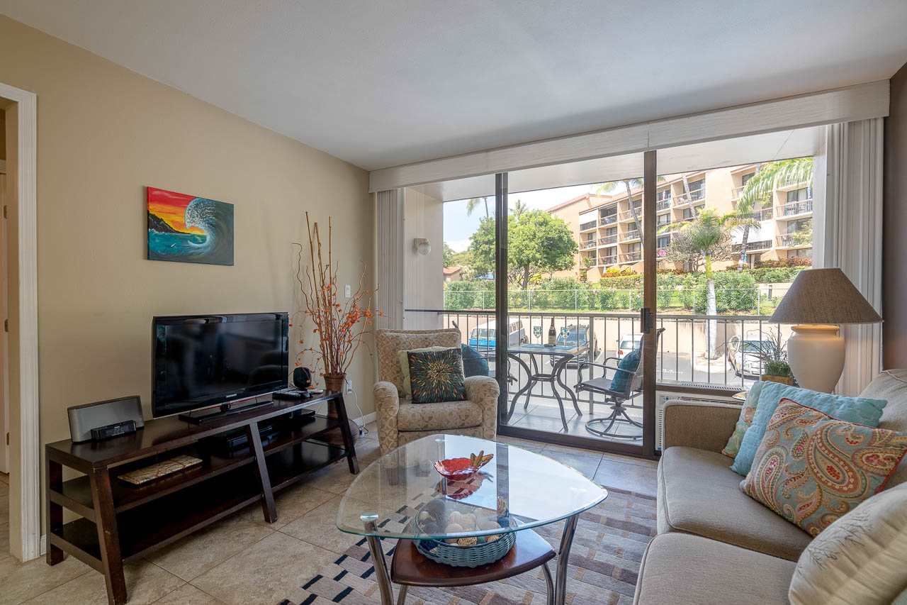 2219 South Kihei Road, Unit B216 Kihei, HI 96753 - Photo 11 of 29 a living room with furniture and a flat screen tv