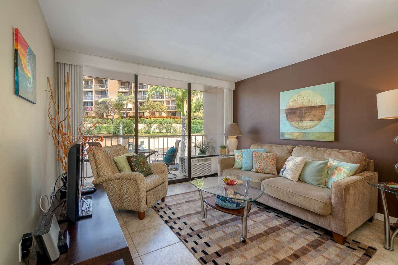 2219 South Kihei Road, Unit B216 Kihei, HI 96753 - Photo 12 of 29 a living room with furniture and a large window