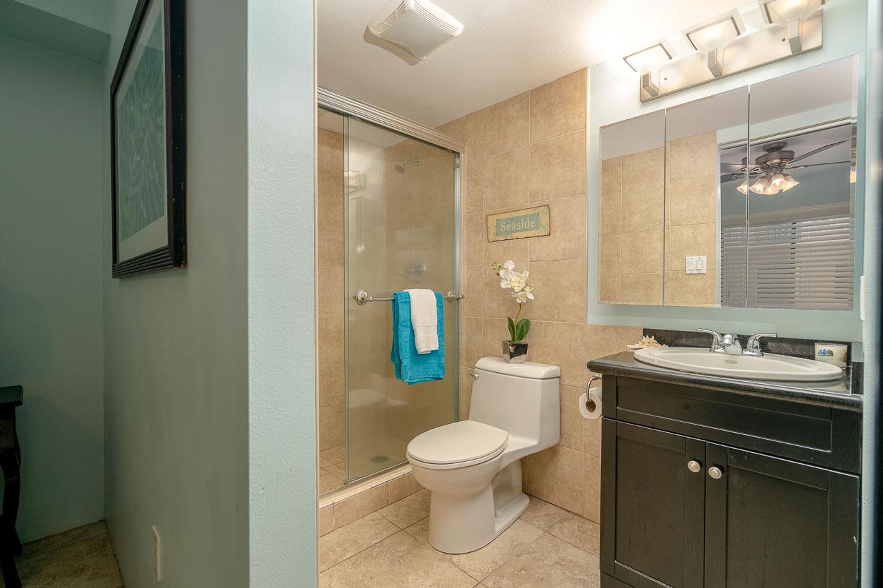 2219 South Kihei Road, Unit B216 Kihei, HI 96753 - Photo 16 of 29 a bathroom with a toilet sink and mirror
