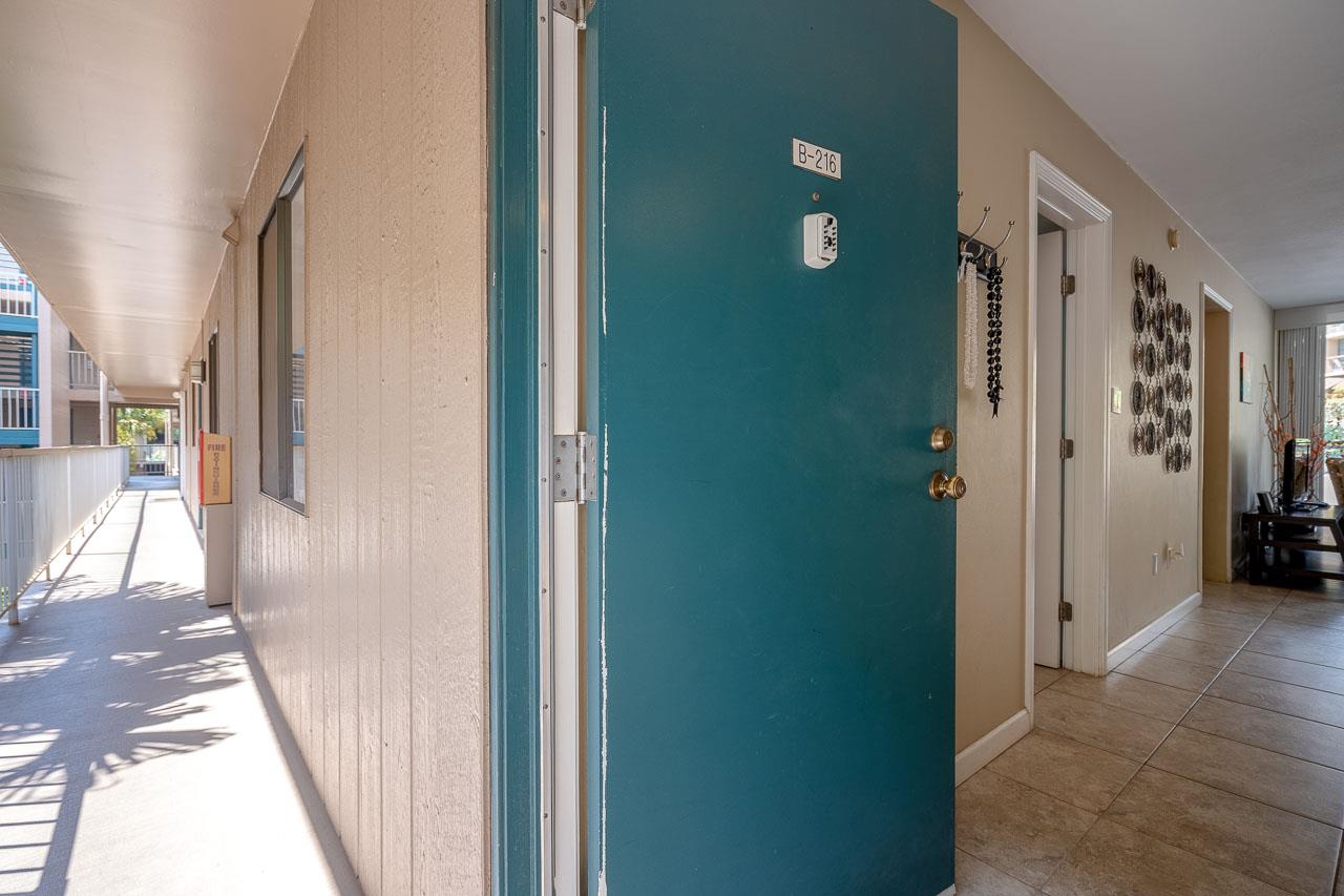 2219 South Kihei Road, Unit B216 Kihei, HI 96753 - Photo 23 of 29 a view of a hallway with a livingroom and a bathroom with sink