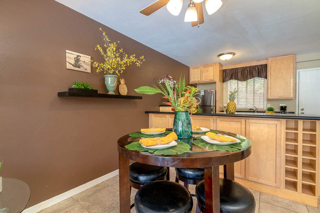 2219 South Kihei Road, Unit B216 Kihei, HI 96753 - Photo 10 of 29 a view of a dining room with furniture and wooden floor