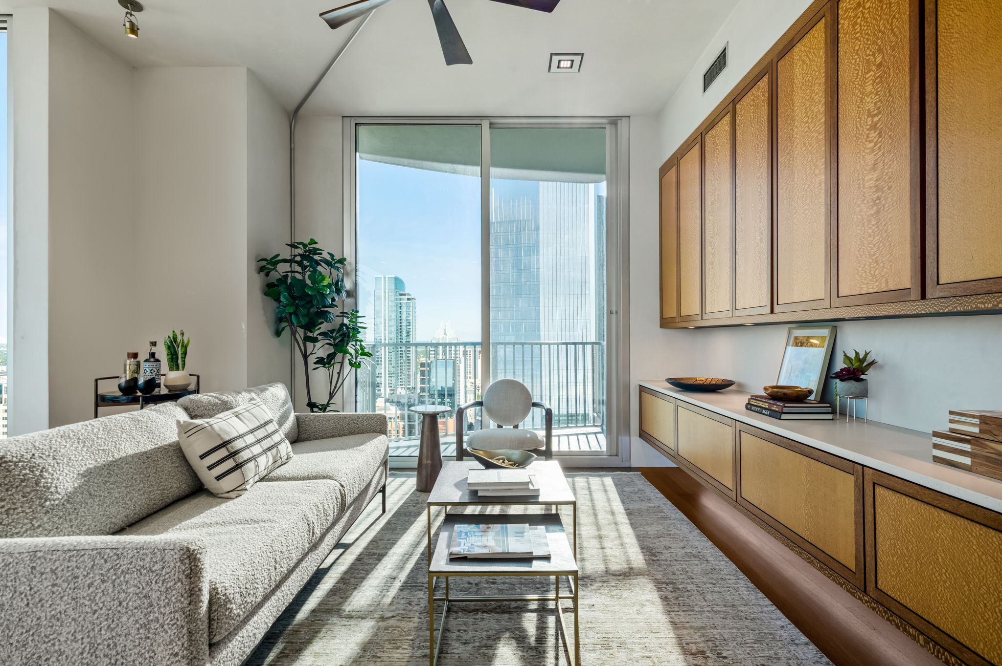 360 Nueces Street, Unit 4211 Austin, TX 78701 - Photo 4 of 40 a living room with furniture and floor to ceiling windows