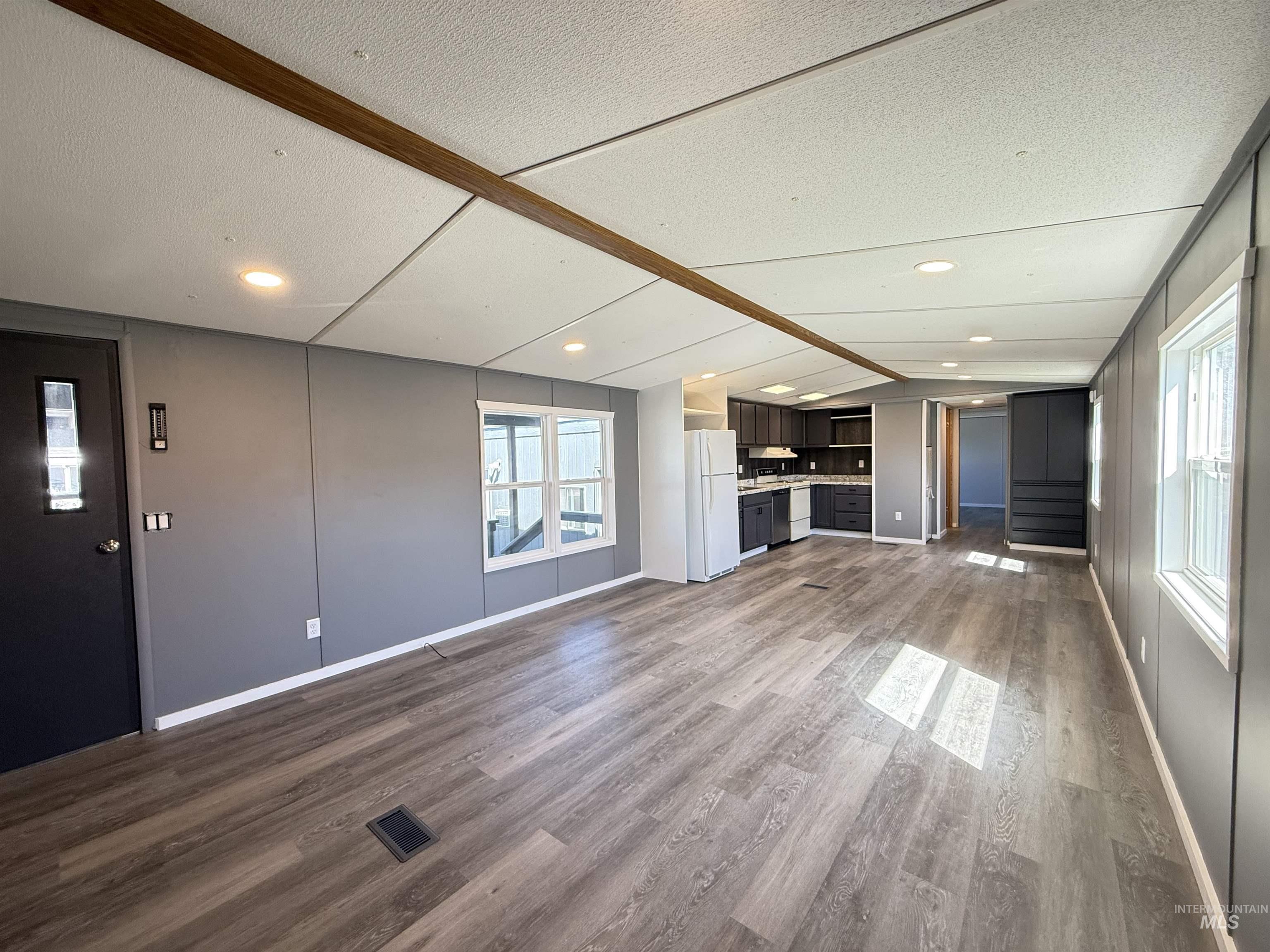 2015 6th Avenue, Unit 321 Clarkston, WA 99403 - Photo 17 of 34 Unfurnished living room featuring dark wood finished floors and baseboards