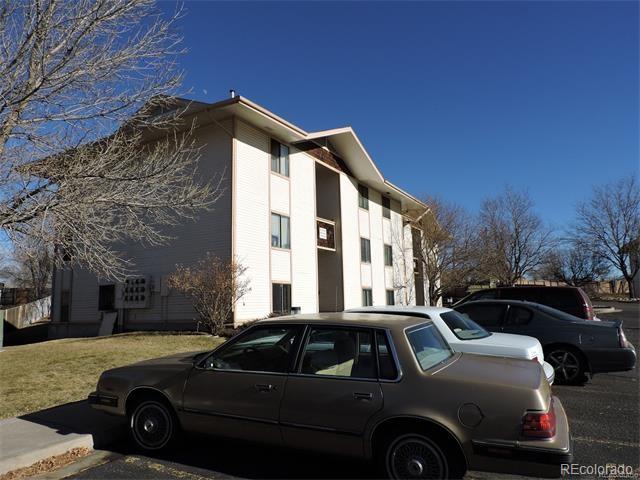 2231 Sable Boulevard, Unit 909 Aurora, CO 80011 - Photo 11 of 16 a view of a car parked in front of a house