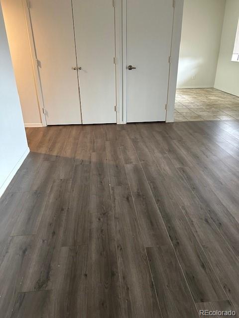 2231 Sable Boulevard, Unit 909 Aurora, CO 80011 - Photo 2 of 16 a view of an empty room and wooden floor