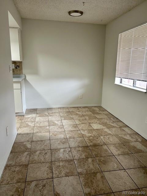 2231 Sable Boulevard, Unit 909 Aurora, CO 80011 - Photo 9 of 16 a view of an empty room and window