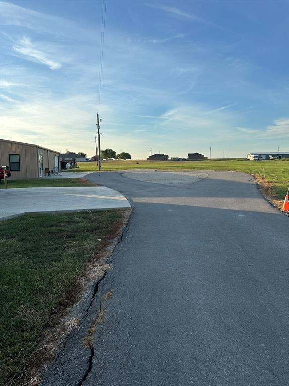 511 John Davis Road Italy, TX 76651 - Photo 24 of 40 a view of a lake with a big yard