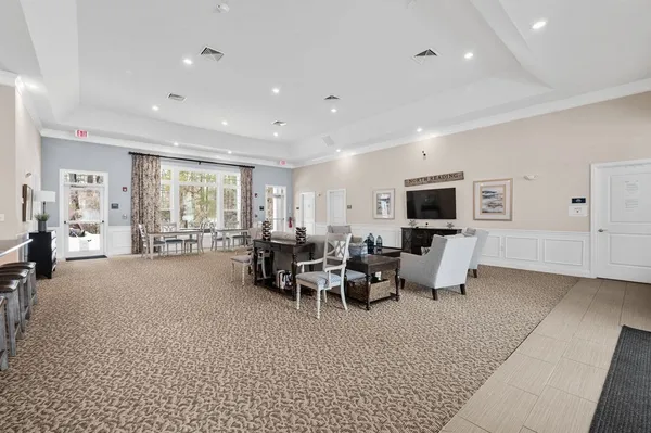 a living room with furniture and a table