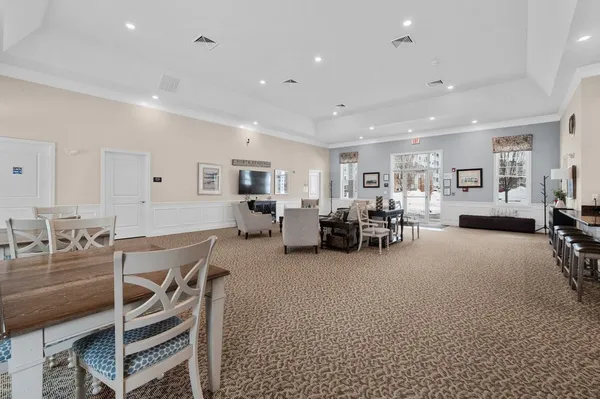 a room with gym equipment and a flat screen tv