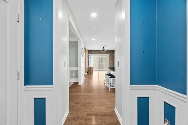 a kitchen with granite countertop a sink a counter space appliances and cabinets
