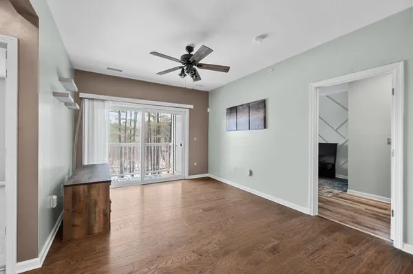 wooden floor in an empty room with a window