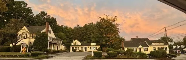 a view of a large house with a yard