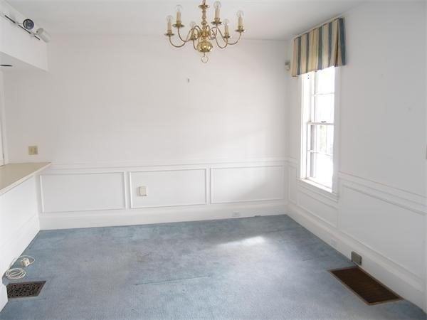 8-10 Concord Road Sudbury, MA 01776 - Photo 15 of 37 wooden floor in an empty room with a window