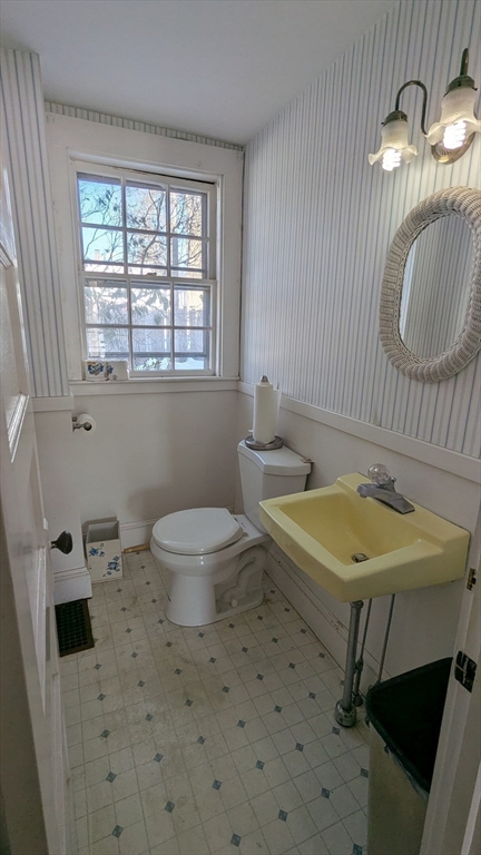 8-10 Concord Road Sudbury, MA 01776 - Photo 18 of 37 a bathroom with a sink a toilet and a mirror