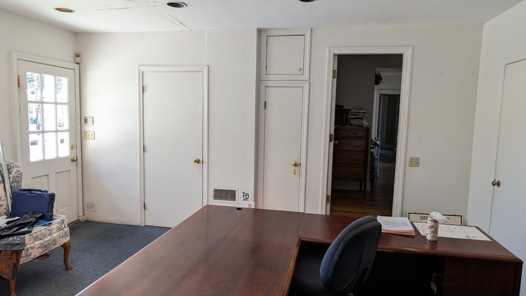 8-10 Concord Road Sudbury, MA 01776 - Photo 19 of 37 a view of a workspace with furniture and a window