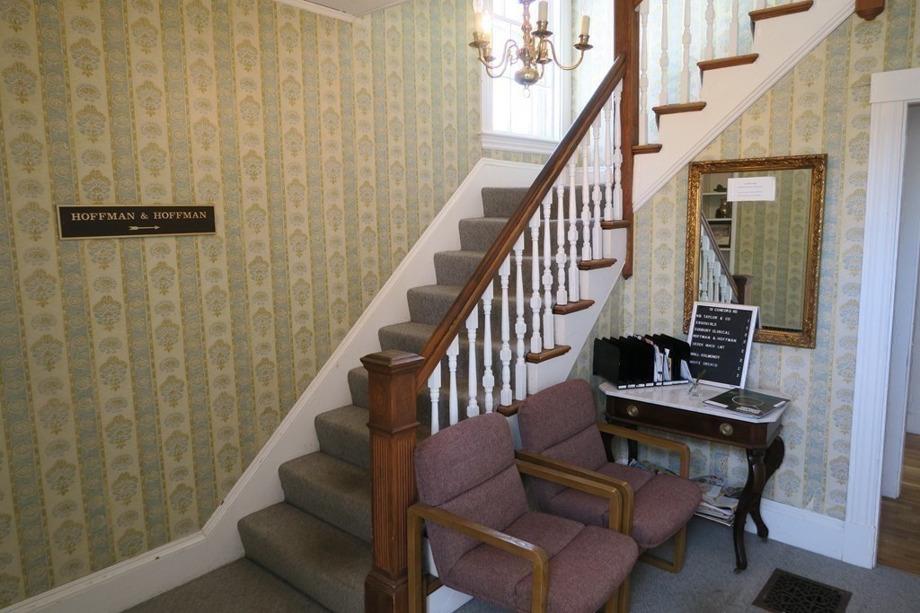 8-10 Concord Road Sudbury, MA 01776 - Photo 21 of 37 a view of entryway with wooden floor and stairs