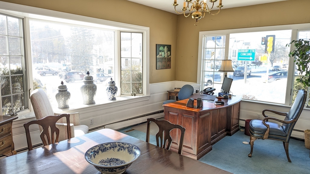 8-10 Concord Road Sudbury, MA 01776 - Photo 34 of 37 a living room with furniture and a large window