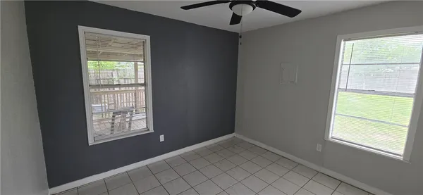 a view of an empty room and window