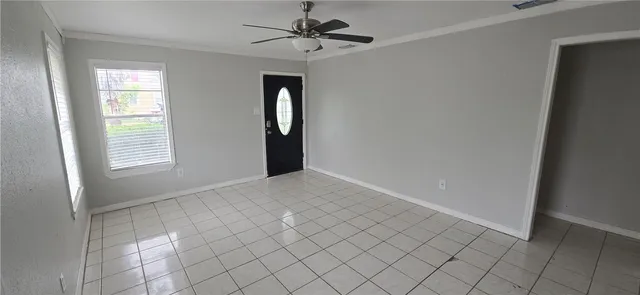 a view of an empty room with a window