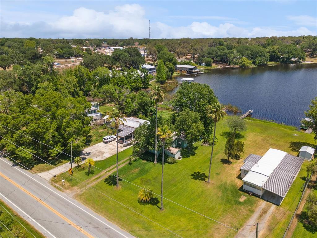 7570 Berkley Road Polk City, FL 33868 - Photo 15 of 16 an aerial view of a residential houses with outdoor space and lake view