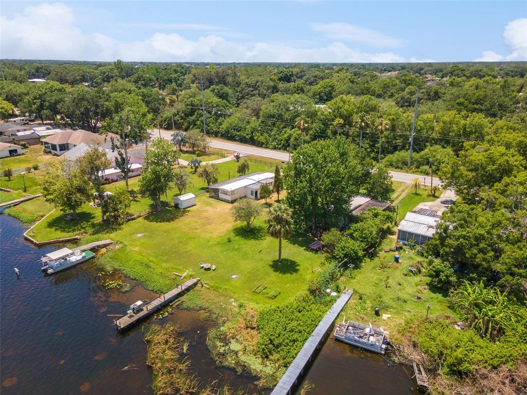 7570 Berkley Road Polk City, FL 33868 - Photo 4 of 16 an aerial view of residential houses with outdoor space