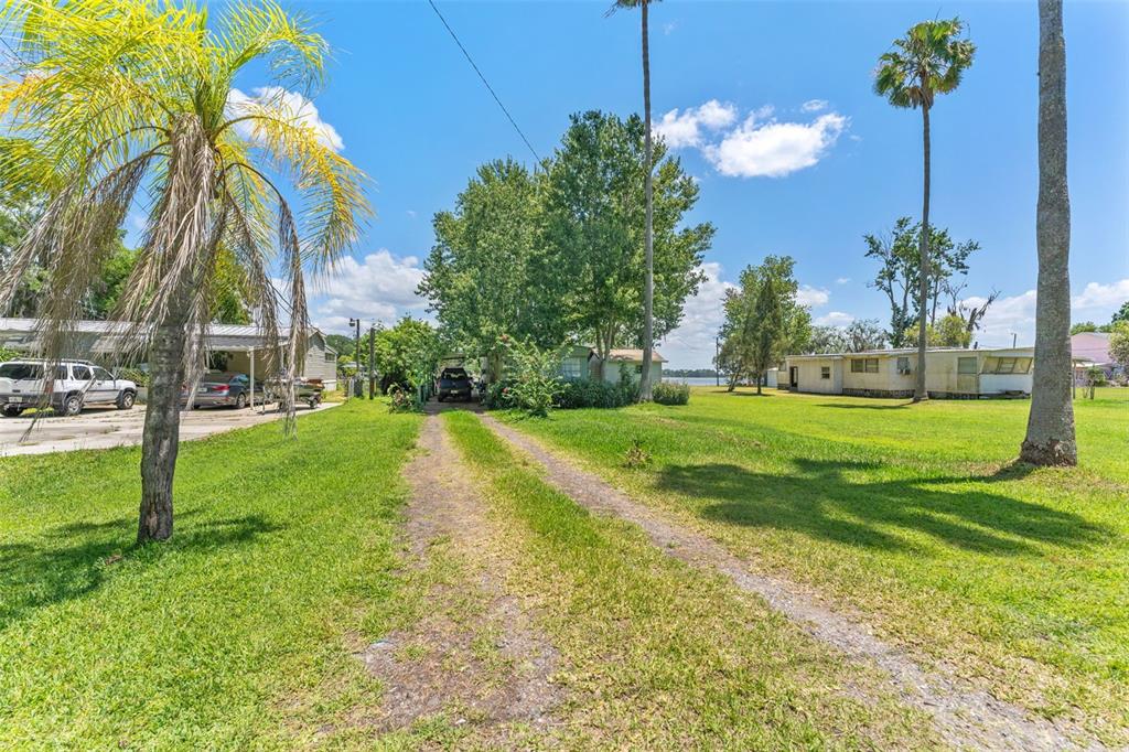 7570 Berkley Road Polk City, FL 33868 - Photo 6 of 16 a view of a house with a swimming pool