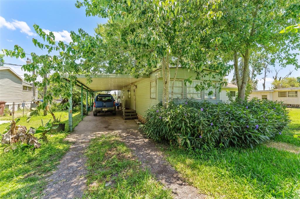 7570 Berkley Road Polk City, FL 33868 - Photo 7 of 16 a view of a backyard with garden