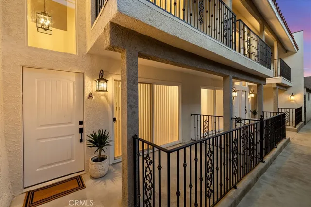 a view of a porch with wooden floor and furniture