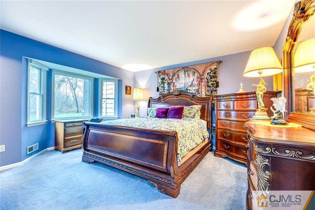 473 Plainfield Road Edison, NJ 08820 - Photo 14 of 28 a bedroom with a bed and windows