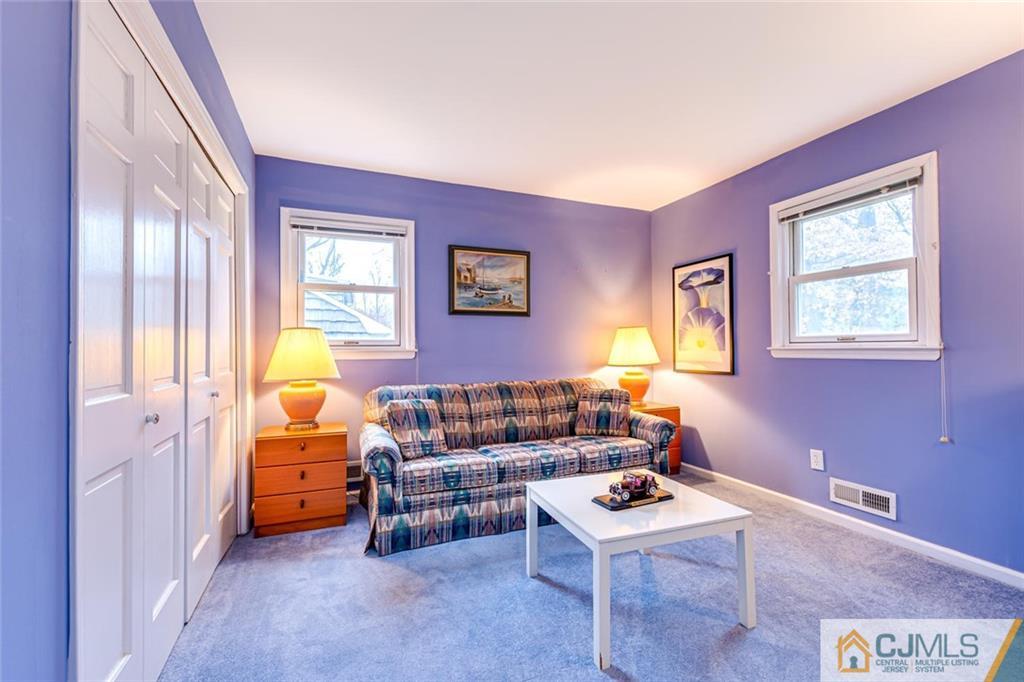 473 Plainfield Road Edison, NJ 08820 - Photo 15 of 28 a living room with furniture a window and a lamp