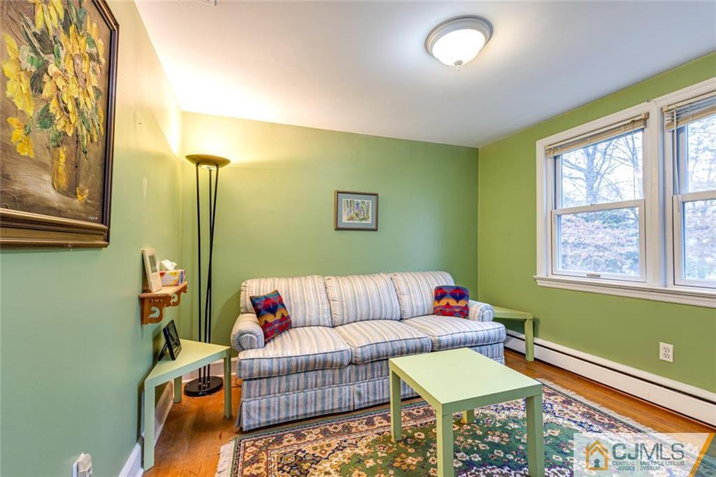473 Plainfield Road Edison, NJ 08820 - Photo 20 of 28 a living room with furniture and a window