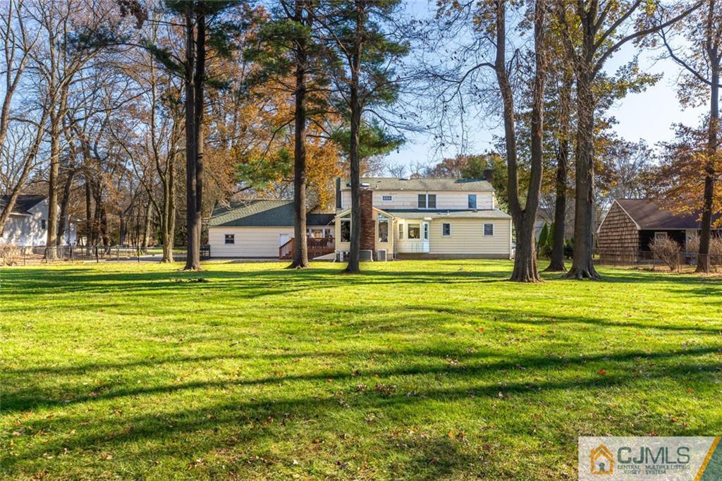 473 Plainfield Road Edison, NJ 08820 - Photo 23 of 28 a front view of a house with a garden