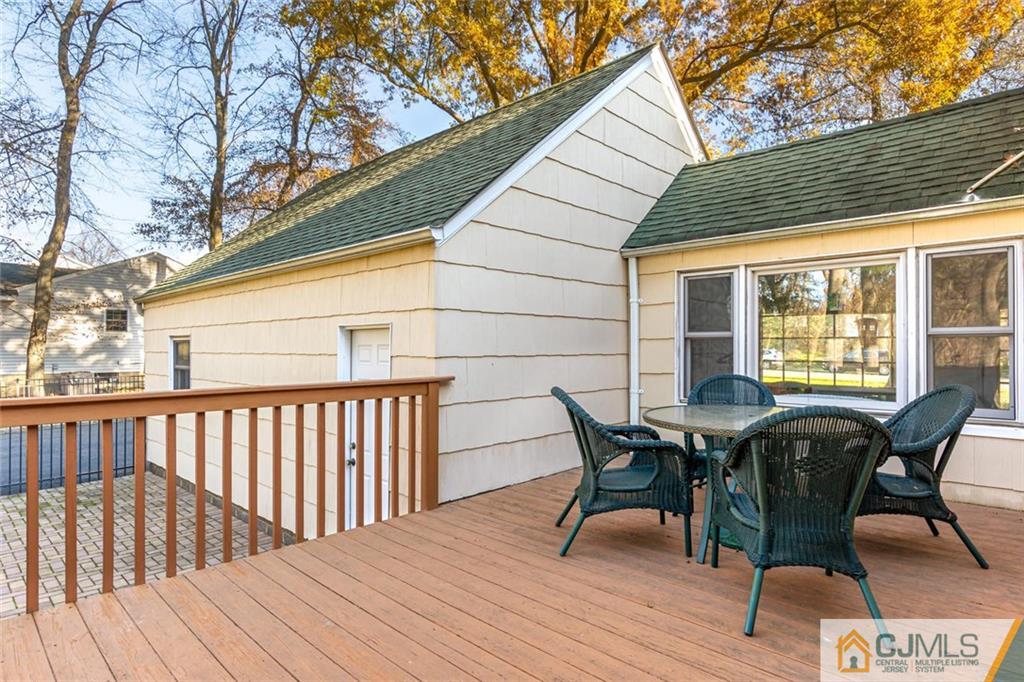 473 Plainfield Road Edison, NJ 08820 - Photo 25 of 28 a view of a wooden chairs on the deck