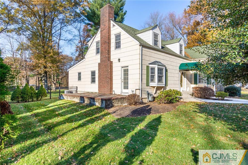 473 Plainfield Road Edison, NJ 08820 - Photo 26 of 28 a front view of house with yard and green space