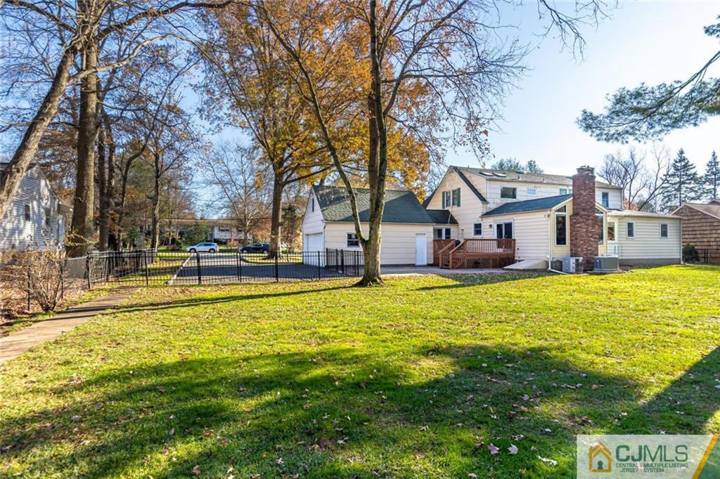 473 Plainfield Road Edison, NJ 08820 - Photo 27 of 28 a view of an house with a swimming pool