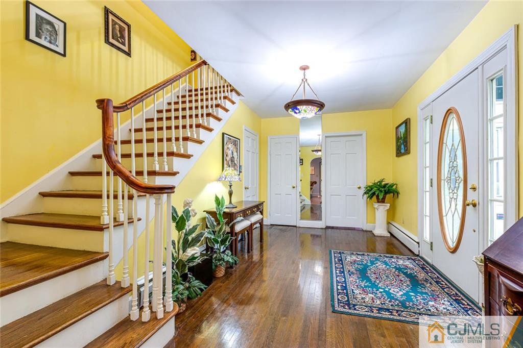 473 Plainfield Road Edison, NJ 08820 - Photo 6 of 28 a view of an entryway wooden floor and a chandelier