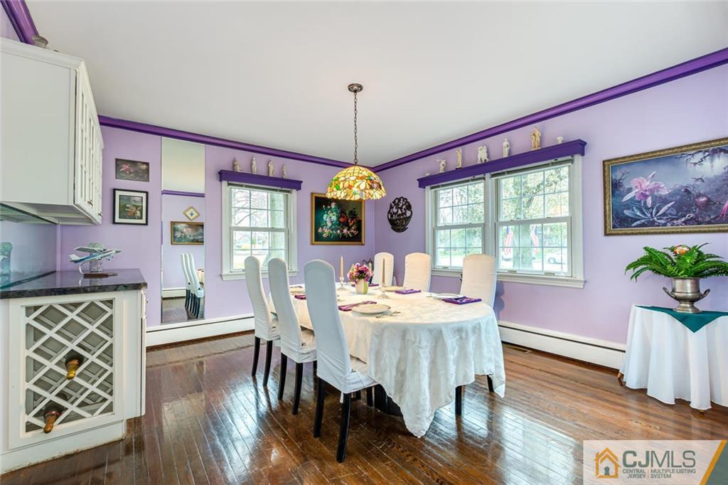 473 Plainfield Road Edison, NJ 08820 - Photo 7 of 28 a dining room with furniture a large window and wooden floor