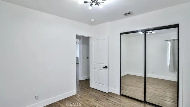 a view of a bathroom with wooden floor