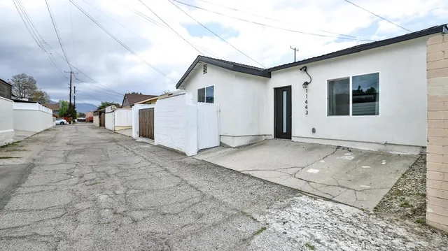 a view of kitchen with wooden floor electronic appliances and window