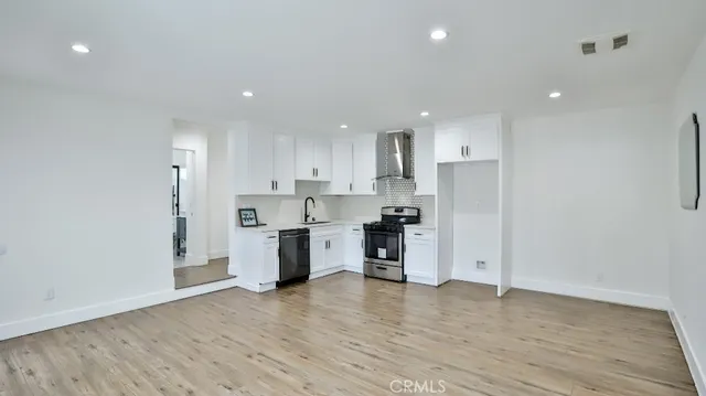 a bathroom with a toilet a sink and shower