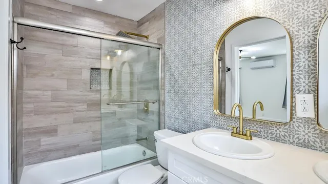 a bathroom with a toilet and a sink