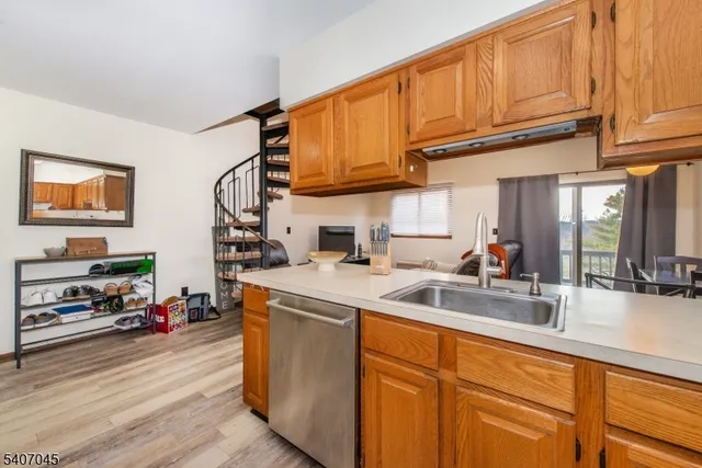 a kitchen with stainless steel appliances a refrigerator and a sink