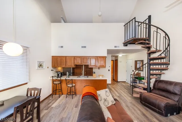 a living room with furniture fireplace and a flat tv screen