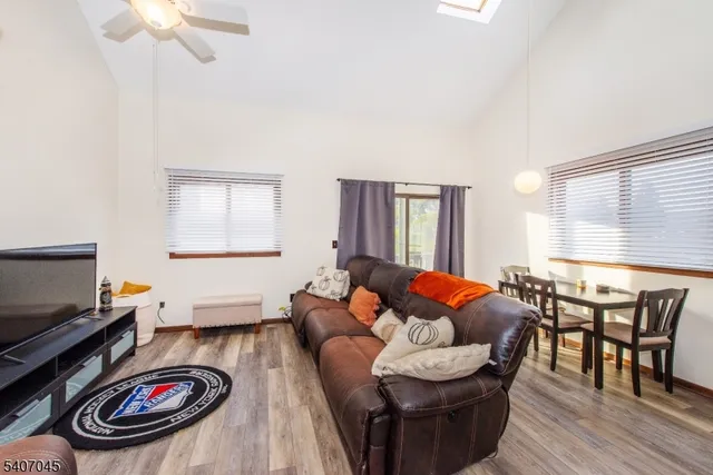 a kitchen with stainless steel appliances granite countertop a sink a stove and cabinets