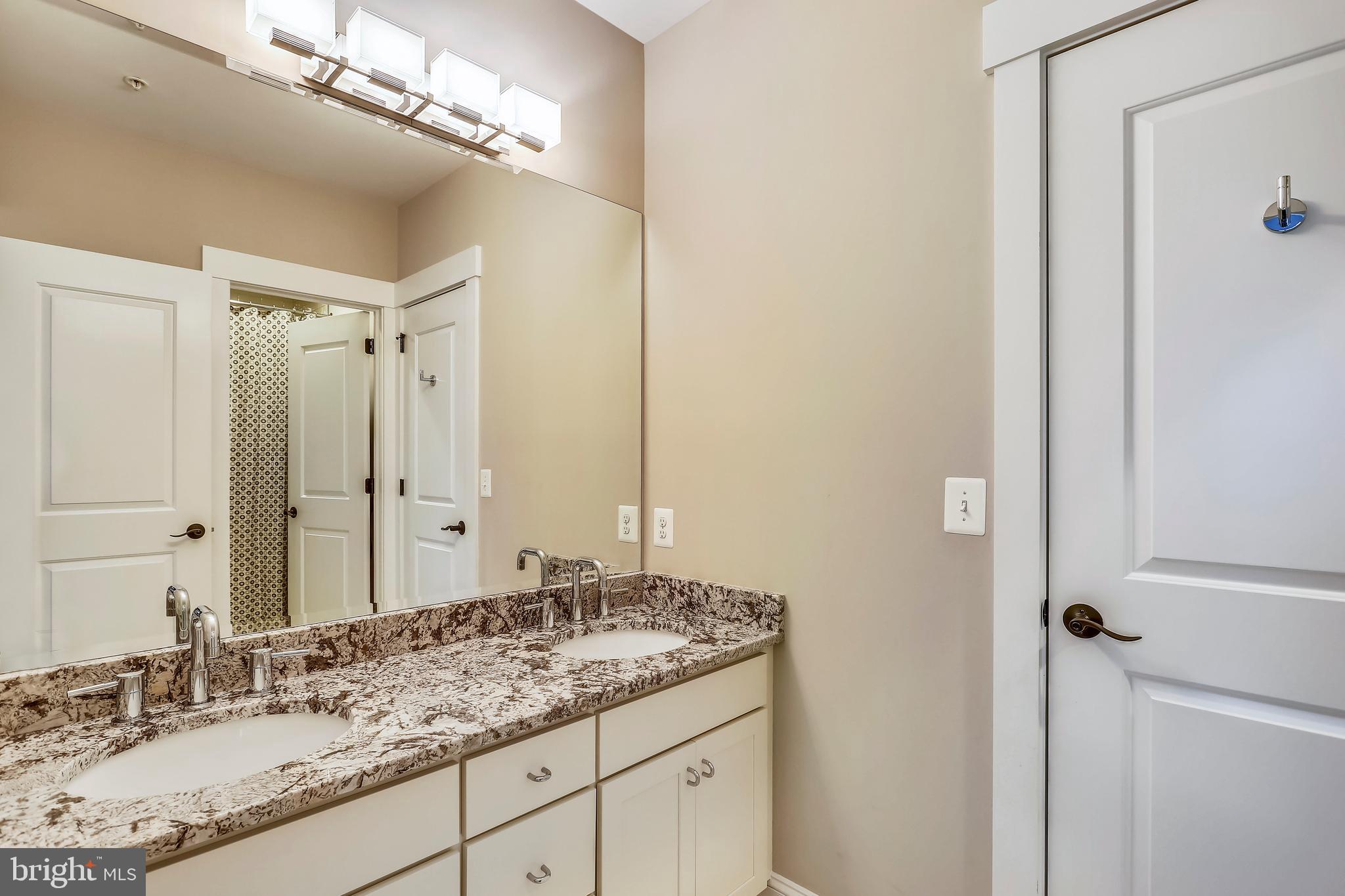 8615 Rayburn Road Bethesda, MD 20817 - Photo 36 of 59 Jack & Jill bathroom with dual vanity sinks & bath