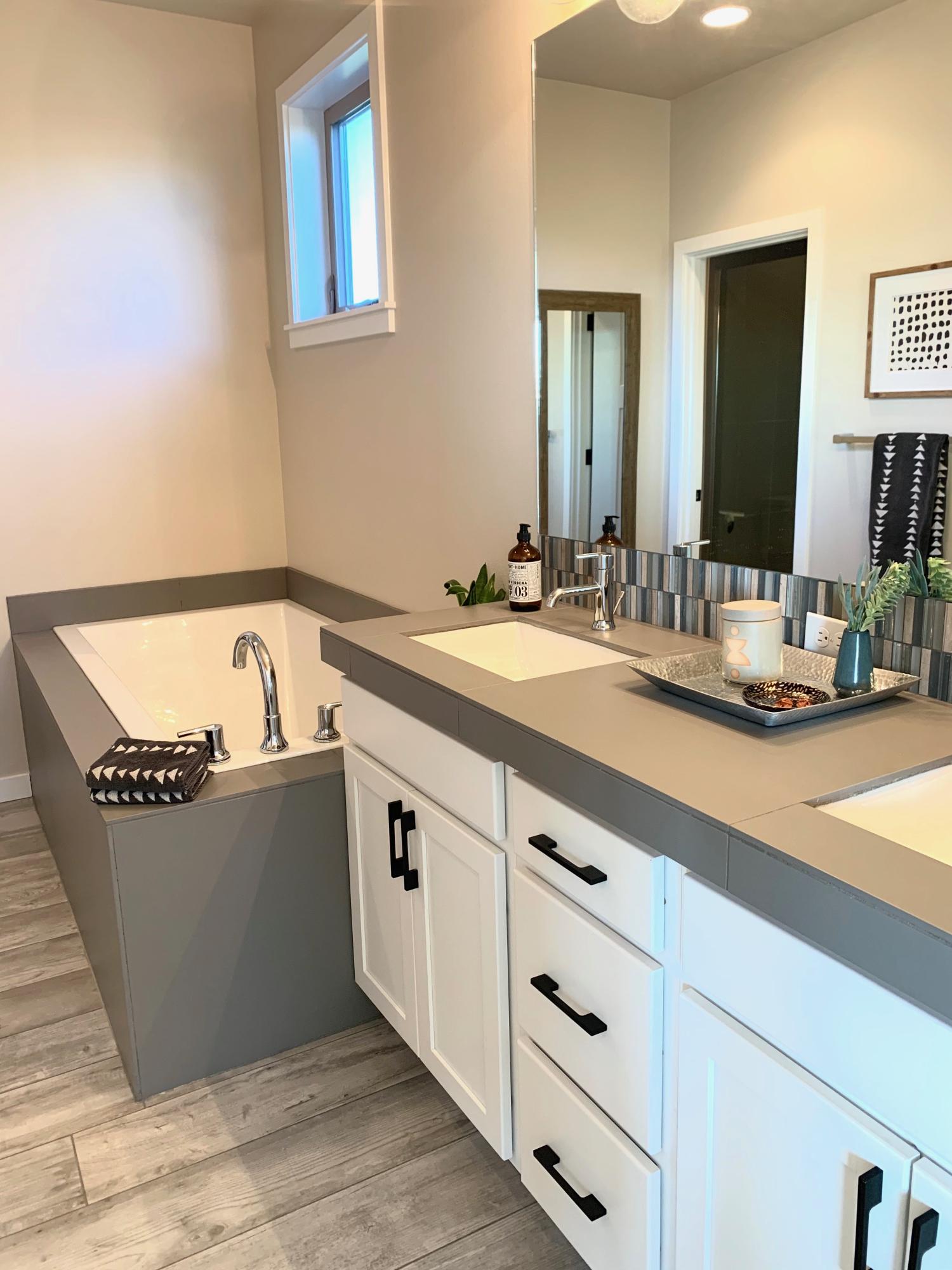 63150 Iner Loop Bend, OR 97701 - Photo 32 of 45 Tile countertops and tub surround