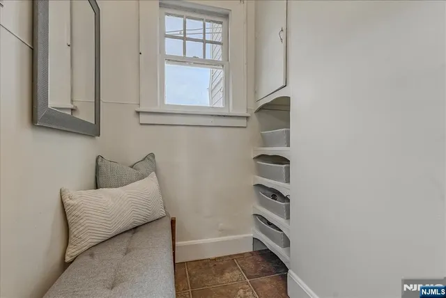 a bathroom with a bathtub and window