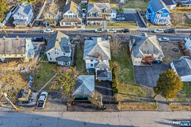 an aerial view of houses with outdoor space