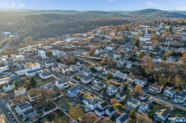 an aerial view of a house with a lake view