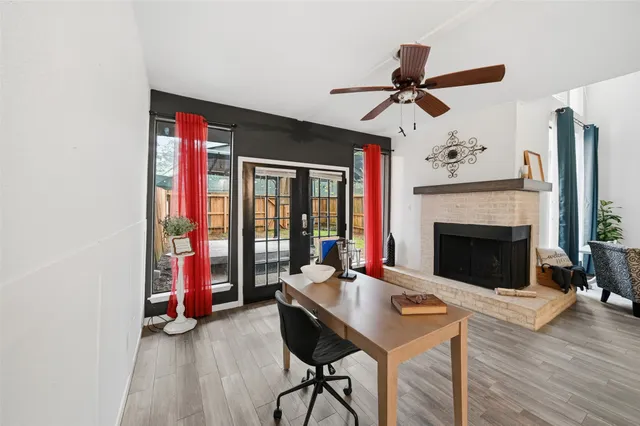 a living room with furniture and a fireplace